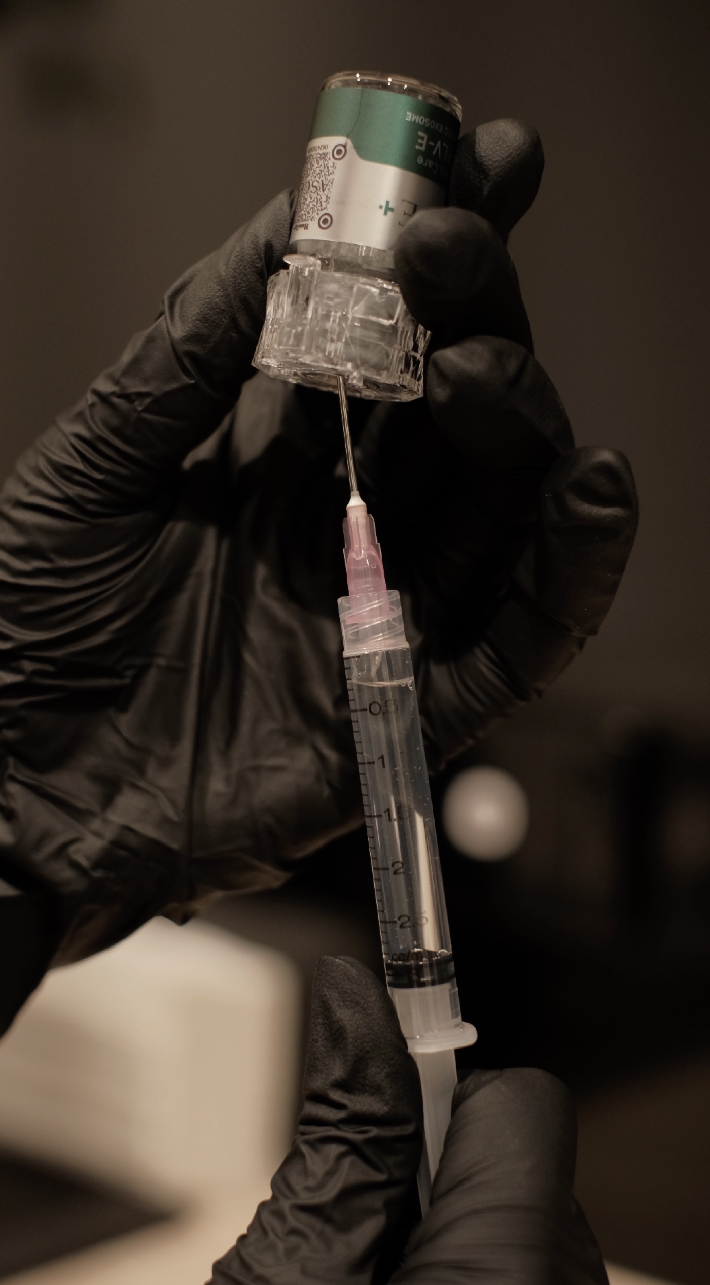 Clinical grade exosome vial being drawn up at Scalp Series